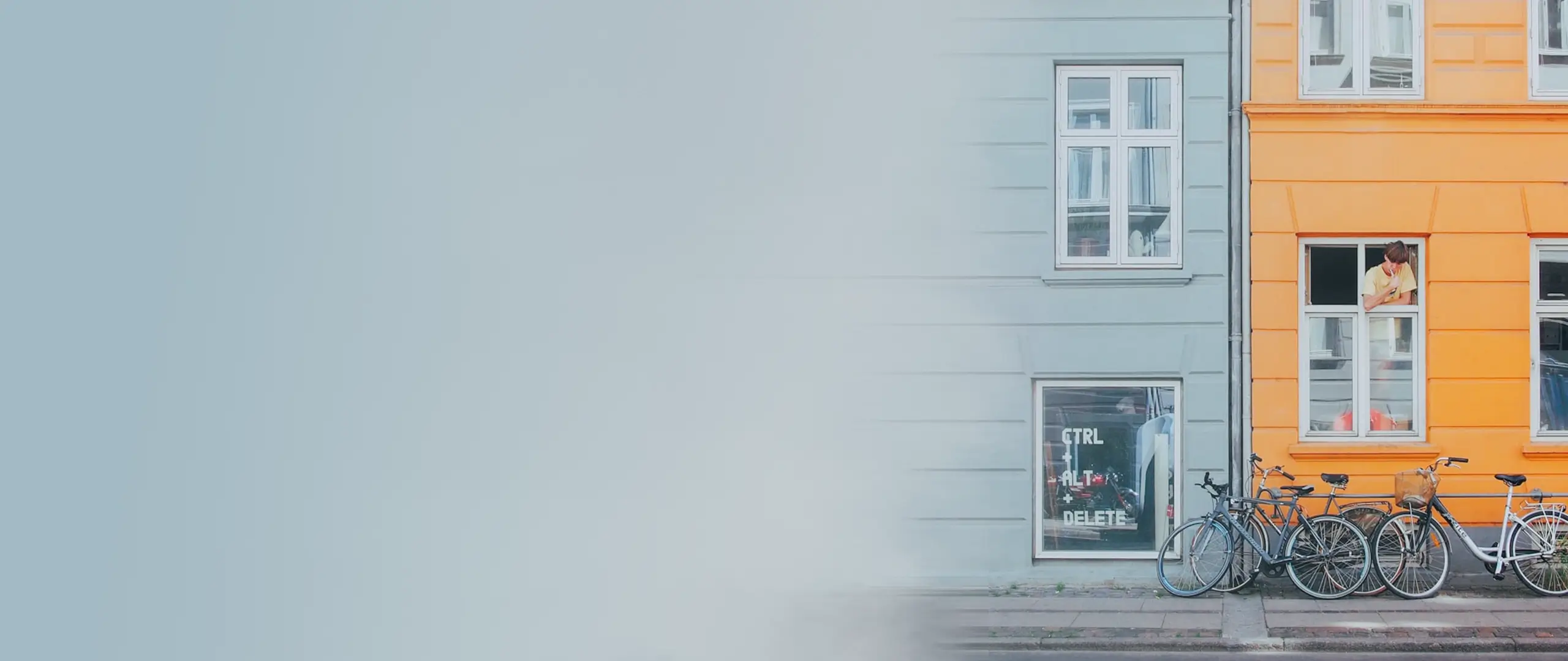 A man is brushing his teeth in the window of a copenhagen appartment, symbolizing the Dico Contribution.